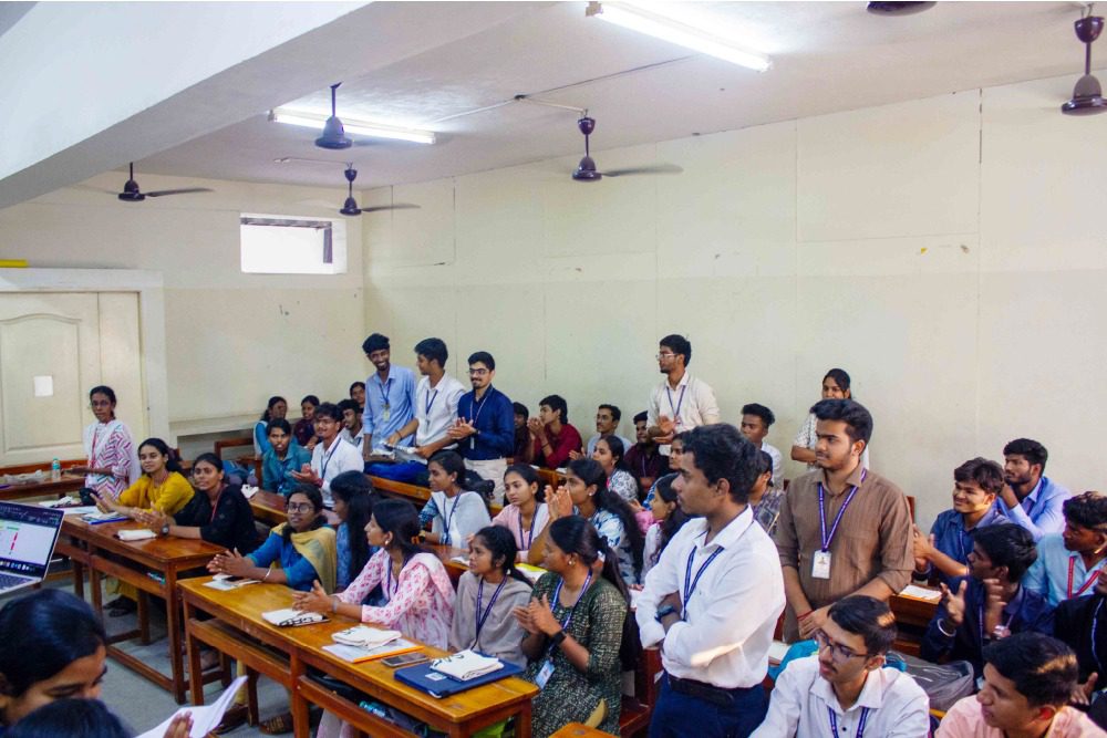 Results are announced to an excited classroom of students at the end of the session
